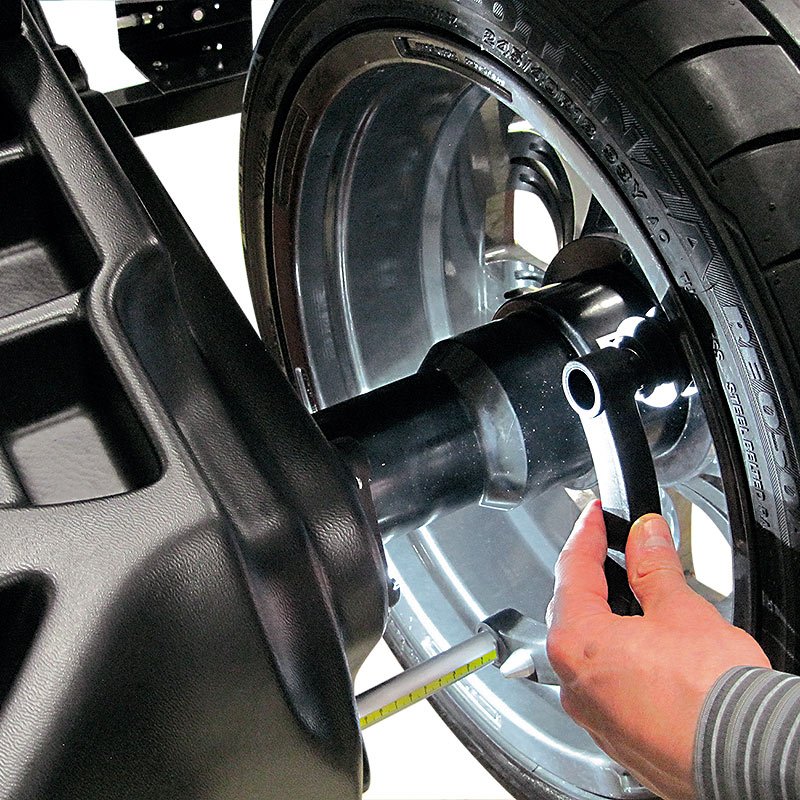 a hand holding a steering wheel